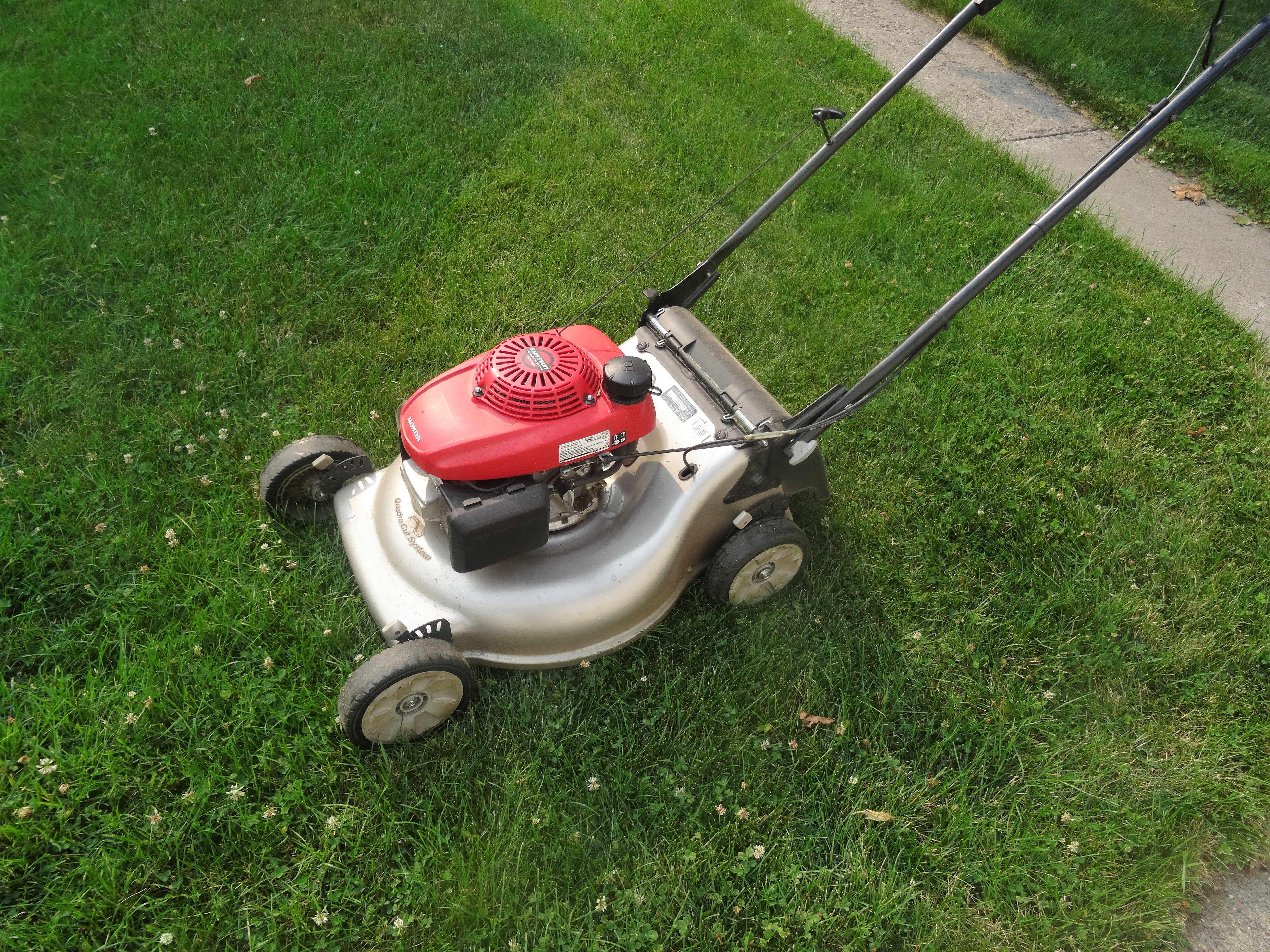 a lawnmower on a residential lawn
